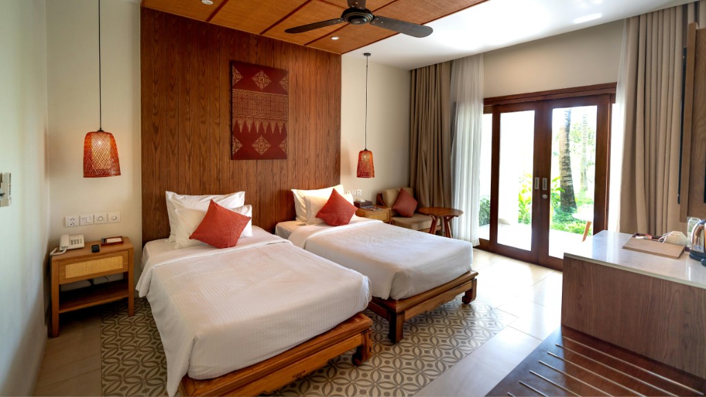 Twin beds made guest-ready in a vacation rental